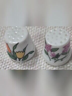 Two cute vintage china thimbles.